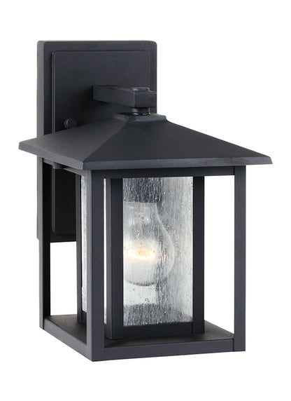 Generation Lighting Hunnington contemporary 1-light outdoor exterior small wall lantern in black finish with clear seeded glass panels 88025-12